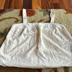 Cute tan linen tank/shirt with thick straps and buttons on the side.